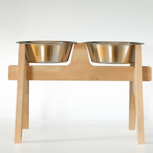 Customizable dog bowl stand, elevated pet feeder, beech wood large dog feeding station. Handmade wooden pet bowl holder with rustic design. Elevated dog food stand, personalized and unique pet dining stand. Perfect for a customized pet bowl setup.