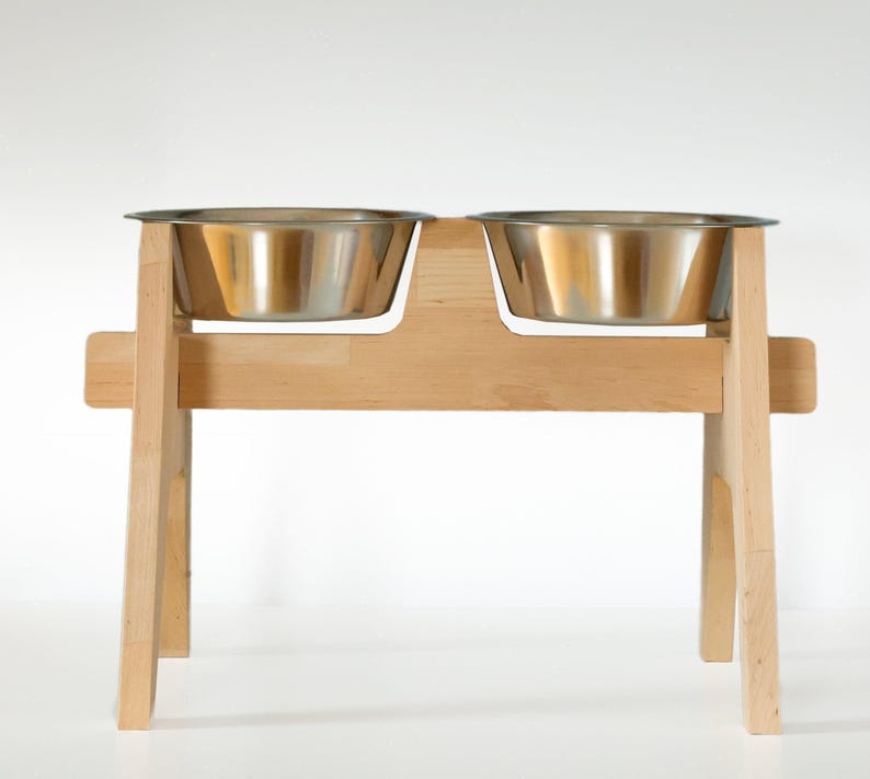 Customizable dog bowl stand, elevated pet feeder, beech wood large dog feeding station. Handmade wooden pet bowl holder with rustic design. Elevated dog food stand, personalized and unique pet dining stand. Perfect for a customized pet bowl setup.