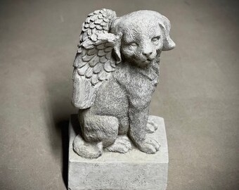 Concrete dog with wings on base statue Detailed puppy figure Outdoor garden or backyard pet sculpture