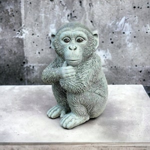 Resting chimpanzee statue Concrete chimpanzee figure Detailed outdoor or indoor sculpture