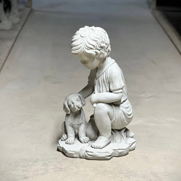 Realistic boy with dog statue Concrete boy with dog figurine Outdoor garden or backyard decoration