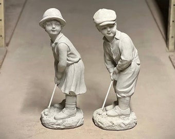 Two golf players statues Concrete standing boy and girl golfers figures Creative golf lovers sculptures