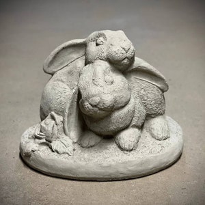 Flower bunnies statue Two rabbits sitting on base figure Hugging rabbits sculpture