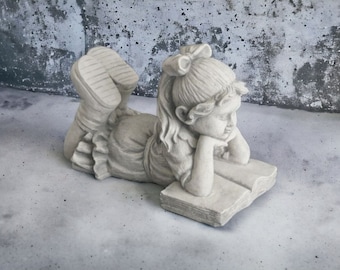 Girl reading book statue Concrete laying girl with book figure Massive yard memorial sculpture