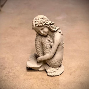 Concrete mermaid on stone statue Sitting mermaid figure Outdoor garden patio or backyard sculpture