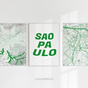 Könnte beinhalten: Drei gerahmte Drucke, zwei mit Karten von Sao Paulo, Brasilien, und einer mit dem Text "SAO PAULO" in grünen Buchstaben auf weißem Hintergrund.