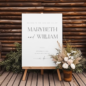 May include: White wedding sign with black text announcing the wedding of Marybeth and William on September 18th. The sign reads "Welcome to the Jack and Jill of Marybeth and William, September 18, 20XX, 125 days until they say I do."