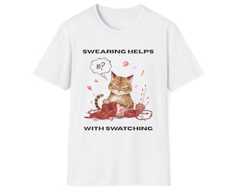 May include: White t-shirt featuring a tabby cat knitting with red yarn and a ball of yarn. The text "SWARING HELPS WITH SWATCHING" is printed above and below the cat illustration. A thought bubble with "#?" is above the cat's head.