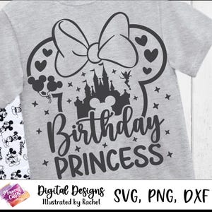 May include: A light gray t-shirt featuring a black graphic design for a 7th birthday. The design includes a bow, Mickey Mouse ears, a castle, stars, and the words "Birthday Princess". The shirt also has the text "Digital Designs" and "Illustrated by Rachel".