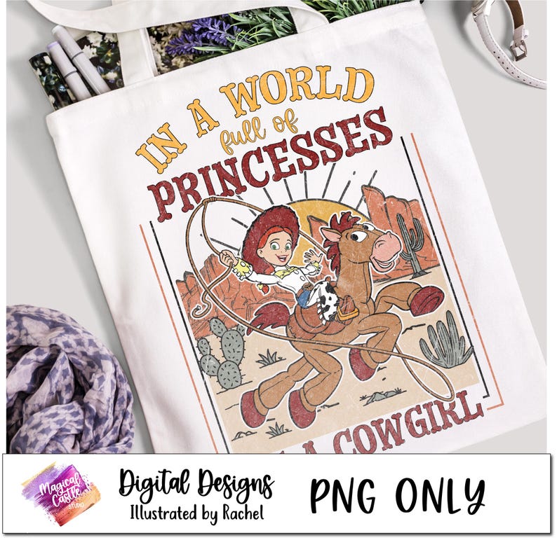 May include: A white tote bag with a colorful graphic design featuring a cartoon cowgirl riding a horse. The text "In a world full of princesses... a cowgirl" is printed on the bag.