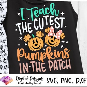 May include: Black tank top with a white graphic design that says "I Teach The Cutest Pumpkins In The Patch". The graphic also features two cartoon pumpkins with Mickey Mouse ears.