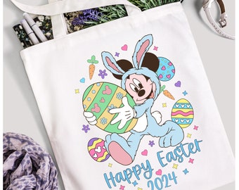 May include: A white tote bag with a cartoon image of Mickey Mouse dressed as an Easter bunny holding a decorated Easter egg. The text "Happy Easter 2024" is printed below the image.
