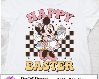 May include: A white t-shirt with a pink, yellow, and brown graphic of Minnie Mouse holding an Easter egg and a basket of eggs. The text "Happy Easter" is in a retro font.