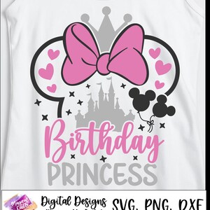 May include: White tank top with a pink bow, Mickey Mouse ears, and hearts. The design includes a gray castle, black Mickey Mouse balloons, and the words "Birthday Princess" in pink and gray.