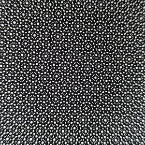May include: A black and white abstract pattern with a circular design. The pattern is made up of small circles and dots, creating a repeating design.