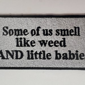 May include: White embroidered patch with black text that reads "Some of us smell like weed AND little babies".
