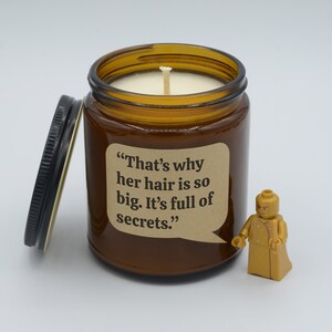 Movie Quote “That’s why her hair is so big. It’s full of secrets.” Funny Soy Candle (9oz, 16oz)
