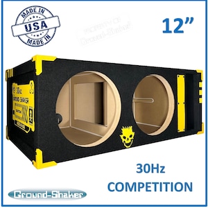 May include: A black and yellow 12-inch subwoofer enclosure with two ports. The enclosure is labelled "Ground-Shaker" and "30Hz Competition".