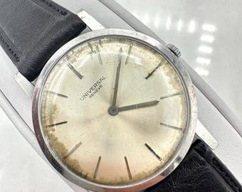 Vintage Universal Geneve Ultra Thin - 8mm thick, Silver Tone, Black Leather, Working, Patina on the Dial, 33mm Case