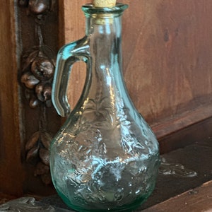 Vintage green glass decanter with cork