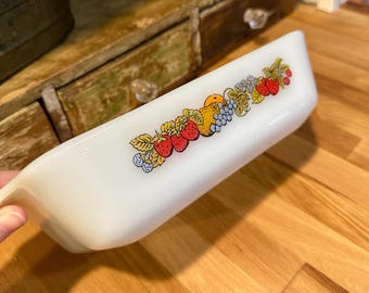vintage Anchor Hocking Fire-King milk glass loaf pan in the "Nature's Bounty" pattern