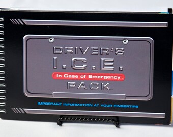 May include: A spiral-bound "Driver's I.C.E. Pack" with a black cover and silver accents. The cover features a silver license plate design with the text "Driver's I.C.E. In Case of Emergency Pack". Blue text at the bottom reads "Important Information at Your Fingertips".