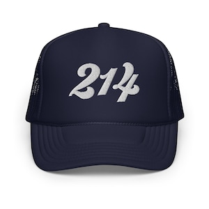 May include: A navy blue trucker hat with a white embroidered design of the number "214" in a retro font.
