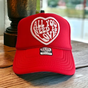 All You Is Need Is Love Embroidered Patch Red Foam Trucker Hat, Otto Trucker Hat
