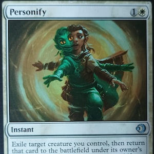 May include: A Magic: The Gathering card titled "Personify." The card features an illustration of a figure with a split face, one side human and the other a green creature. The card text describes an instant spell.