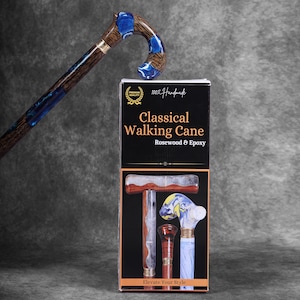 May include: A handcrafted classical walking cane made of rosewood and epoxy. The cane features a curved handle with blue accents and a gold-colored band. The product packaging displays the text "Classical Walking Cane" and "Elevate Your Style."