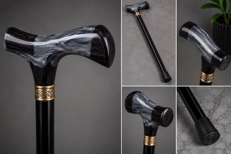 May include: A walking cane featuring a black shaft and a T-shaped handle with a marbled black and white pattern. A gold-colored metal collar with an intricate woven design connects the handle to the shaft, which ends in a black rubber tip.