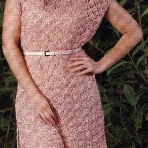 May include: A pink crocheted dress with a white belt. The dress has a loose fit and a scalloped hem.