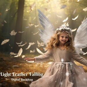 May include: A young girl with blonde hair and a white dress with wings stands in a forest with white feathers falling around her. The background is a blurred image of trees and sunlight.