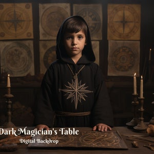 May include: A young person dressed in a dark robe with a star-shaped pendant stands behind a wooden table with candles, a book, and other objects. The text "Dark Magician's Table - Digital Backdrop" is at the bottom of the image.