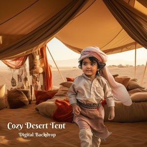 May include: A young child wearing a colorful turban stands inside a desert tent. The tent is decorated with pillows and blankets. The child is looking to the right of the image. The text "Cozy Desert Tent - Digital Backdrop" is at the bottom of the image.