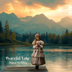 May include: A young girl in a long, brown dress stands on a wooden dock overlooking a peaceful lake. The lake is surrounded by lush green trees and mountains in the background. The sky is a vibrant orange and yellow, creating a beautiful sunset.