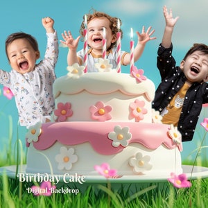 May include: Three children celebrate a birthday with a large pink and white cake decorated with white flowers. The cake is on a white plate and surrounded by green grass and pink flowers.