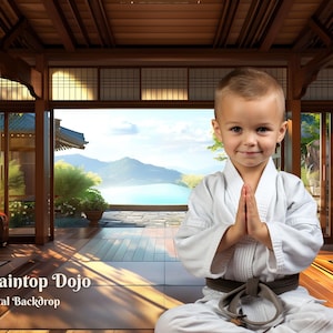 May include: A young boy in a white karate uniform sits in a meditative pose with his hands clasped in front of him. He is in a traditional Japanese dojo with wooden floors and large windows overlooking a mountain landscape. The text "Mountaintop Dojo" and "Digital Backdrop" is visible in the lower left corner of the image.
