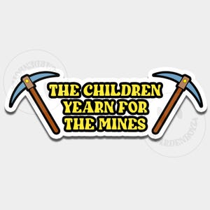Puede incluir: Una pegatina con el texto "THE CHILDREN YEARN FOR THE MINES" en amarillo y negro. Dos picos con hojas azules y mangos marrones flanquean el texto, sobre un fondo blanco.