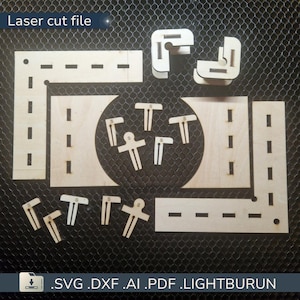 Peut inclure: Fichier de découpe laser de pièces en bois pour un modèle. Comprend des segments de route, des pièces d'angle et de petits composants en forme de T et de personne. Le texte "Laser cut file" est en haut. Types de fichiers : .SVG .DXF .AI .PDF .LIGHTBURUN.