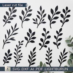 May include: A collection of twelve distinct black leaf silhouettes arranged in a grid pattern. The image includes the text Laser cut file at the top and .SVG .DXF .AI .PDF .LIGHTBURN at the bottom, indicating a digital design set for cutting.