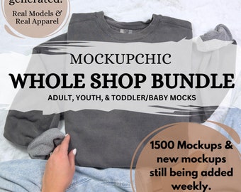 May include: A gray sweatshirt folded on a white surface with a hand holding a gray sock. The text "MOCKUPCHIC WHOLE SHOP BUNDLE ADULT, YOUTH, & TODDLER/BABY MOCKS 1500 Mockups & new mockups still being added weekly. LIFETIME ACCESS" is visible on the image.