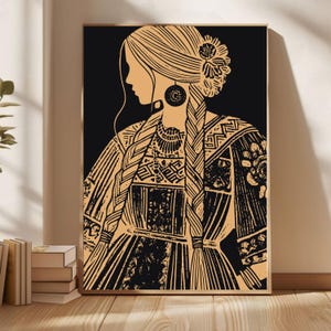 May include: A framed art print depicting a woman in profile, adorned with long braids and traditional attire. The artwork uses black and tan tones, showcasing detailed patterns on the dress and hair. The woman is wearing large earrings and a floral hair accessory.