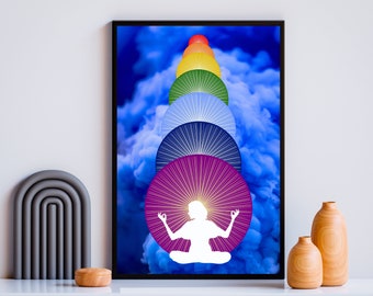 May include: A framed art print featuring a white silhouette of a person meditating, superimposed over a series of colorful, radiating circles. The background is a vibrant blue, cloud-like design. The artwork is displayed on a white shelf with decorative items.