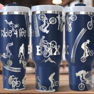 May include: A blue stainless steel travel mug with a handle. The mug features a silver design of BMX bikes and the text "Ride 4 Life" and "BOIX".