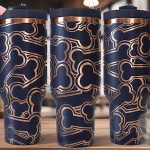May include: Navy blue insulated tumbler with a gold bone pattern. The tumbler has a handle and a lid. The design is repeated across the surface. The tumbler is approximately 10 inches tall.