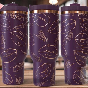 May include: Purple stainless steel travel mug with a gold design of lips and syringes. The mug has a lid and a handle.