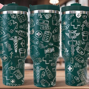 May include: A green stainless steel travel mug with a white design of medical symbols, pills, and other medical related items. The mug has a handle and a lid.