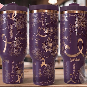 May include: Three purple insulated tumblers with gold floral and ribbon designs. The tumblers have a handle and a lid. The words "survivor", "brave", "warrior", "love", "courageous", "strong", and "fighter" are written on the tumblers.