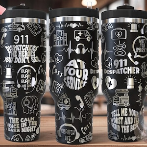 May include: A black and silver stainless steel travel mug with a handle. The mug features a design of various 911 dispatcher related icons and text, including "911 Dispatcher", "At Your Service", and "The Calm Voice in the Dark Night".